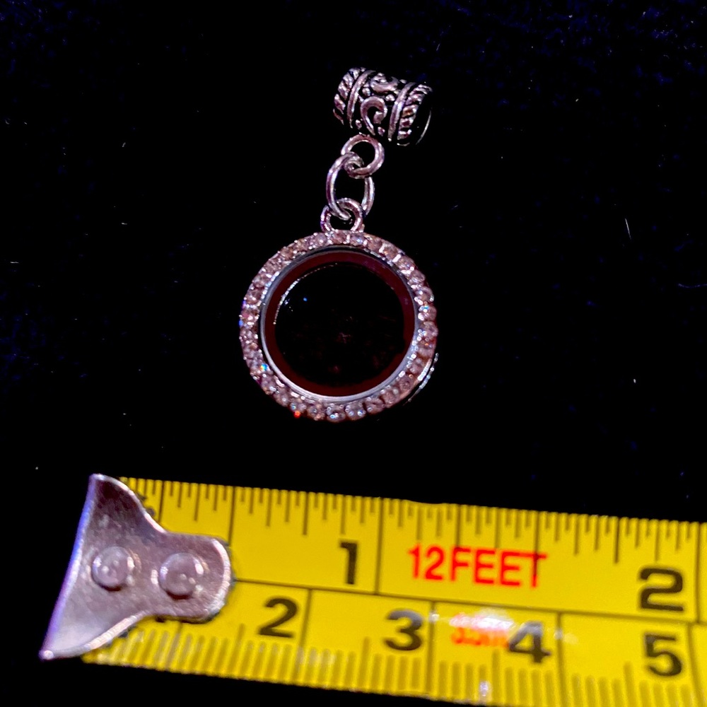 New locket charm holds up to 5 charms included in purchase.